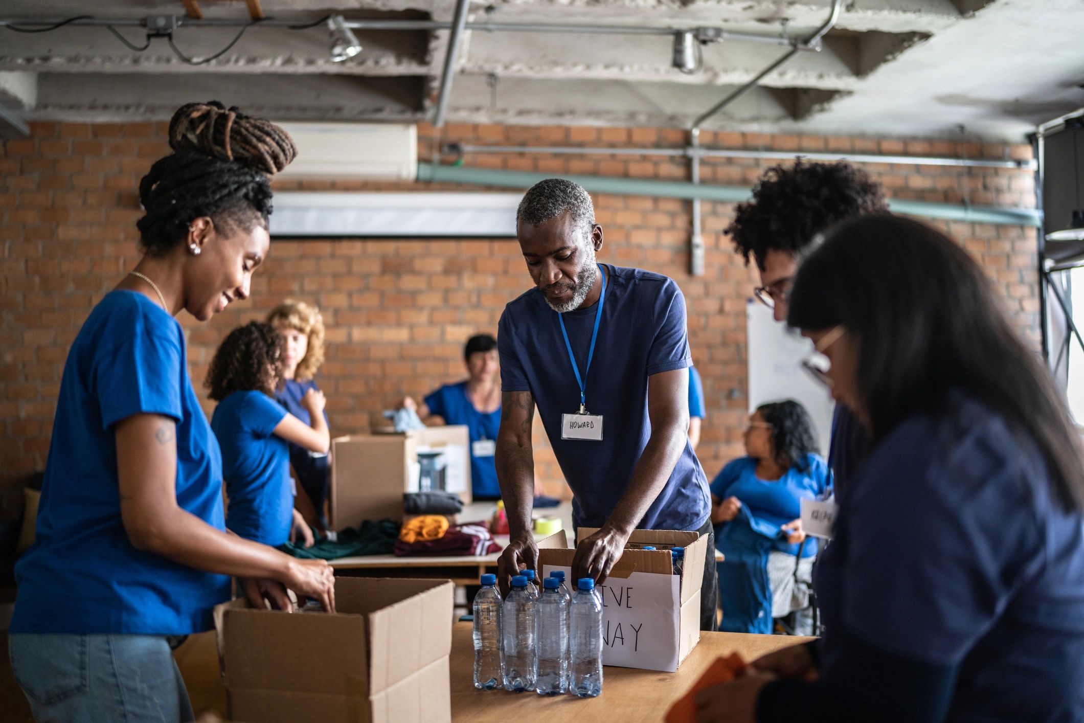 Volunteers organizing donations in a community center
