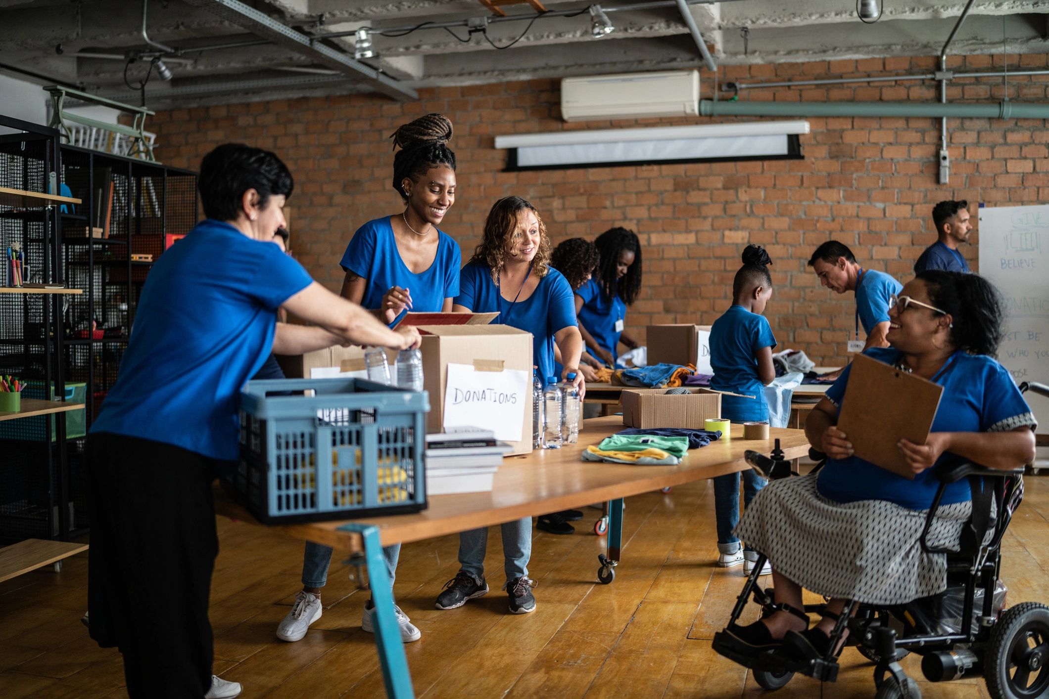 Inclusive volunteer team working together in a community center