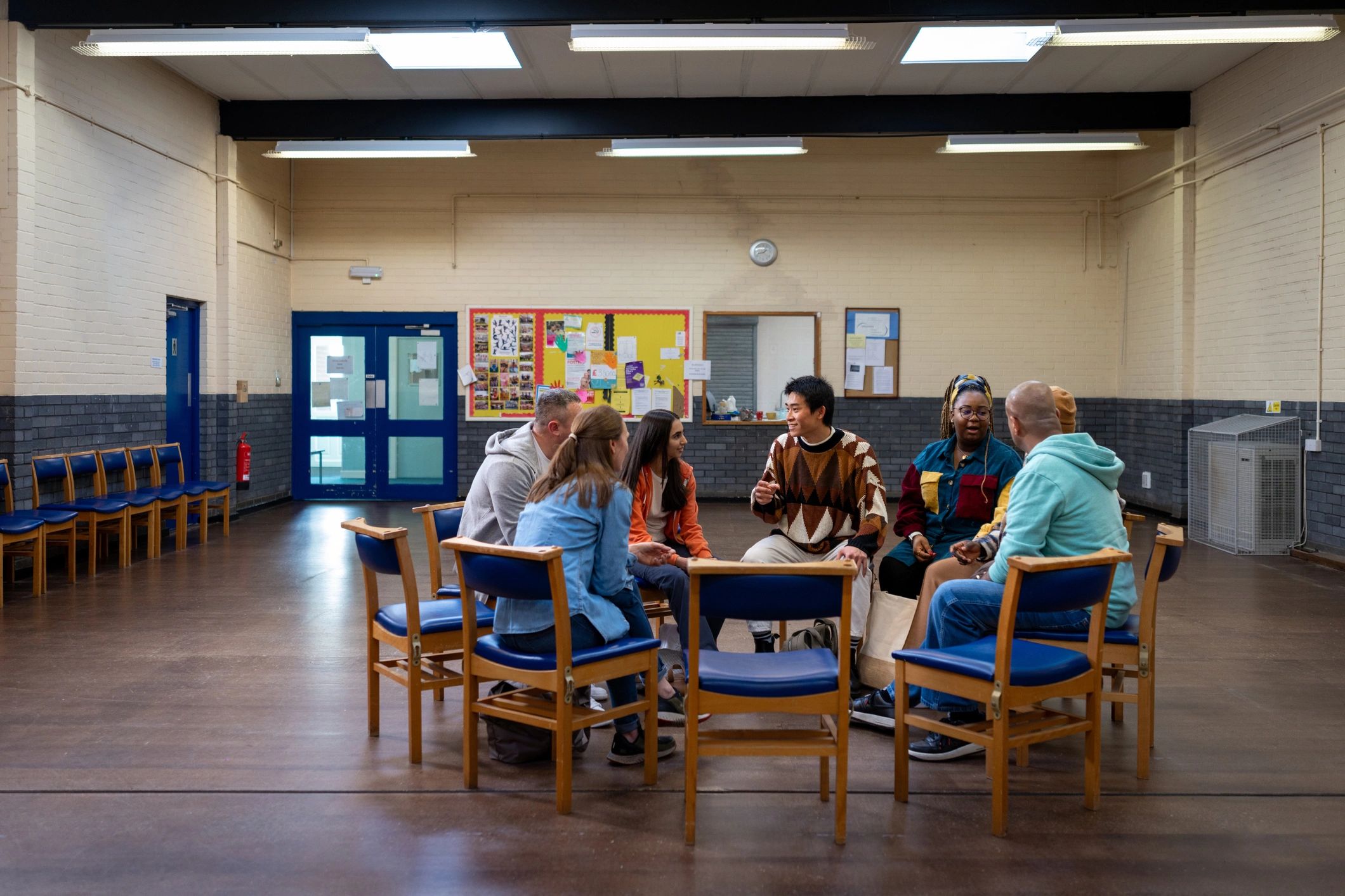 Adults gathered in a community workshop discussion